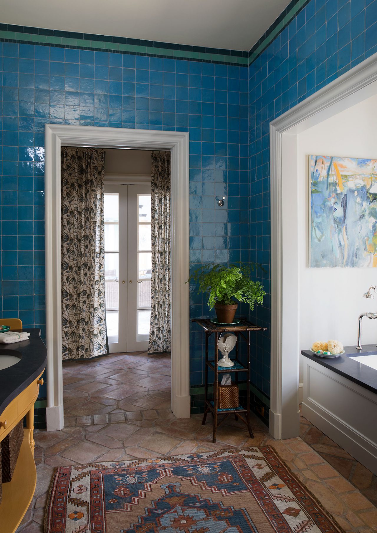 Bathroom with blue tile walls